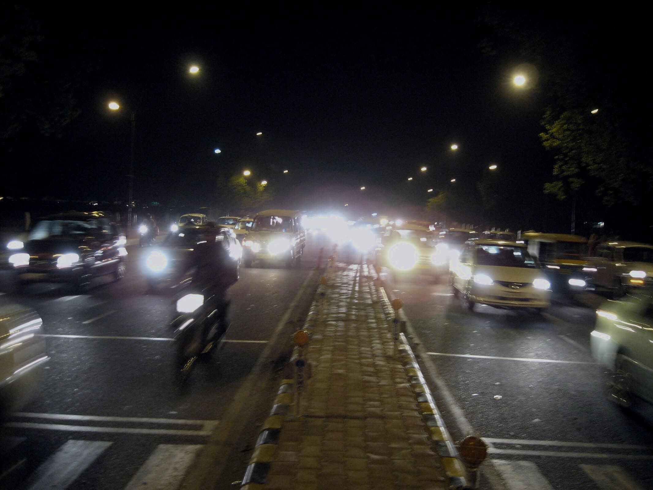 Streams of night traffic moving through the city